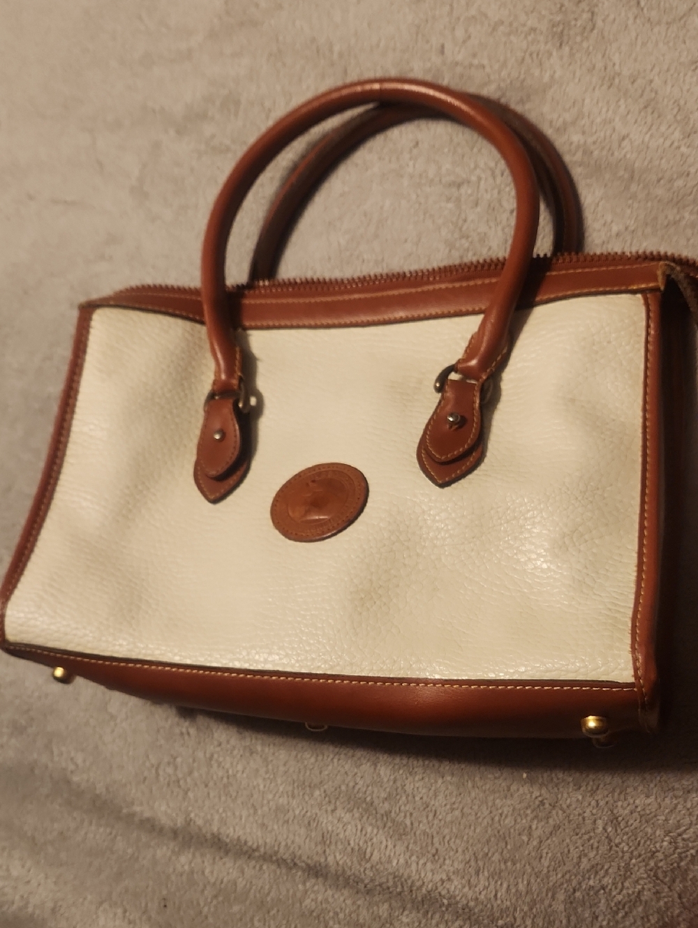 vintage Dooney & Bourke All-Weather Leather satchel bag in white and brown.